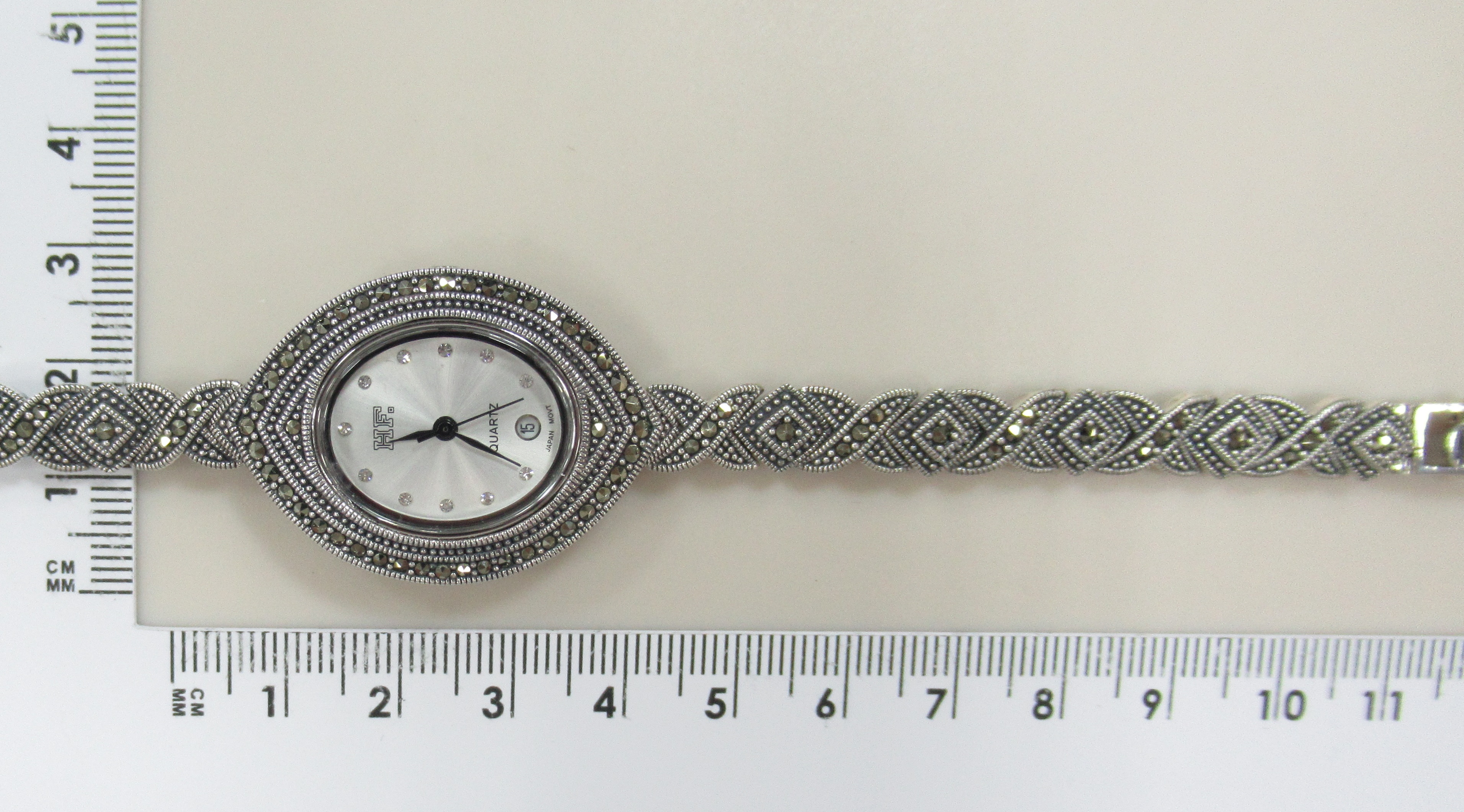 Серебряные часы с марказитами